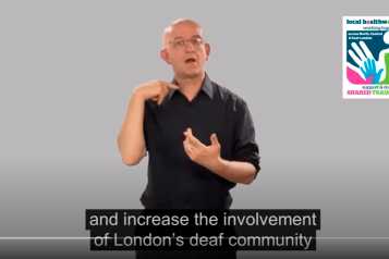 Screenshot from a video of a man doing sign language