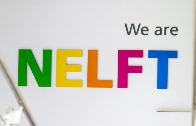 A photo of a sign that says 'we are NELFT'