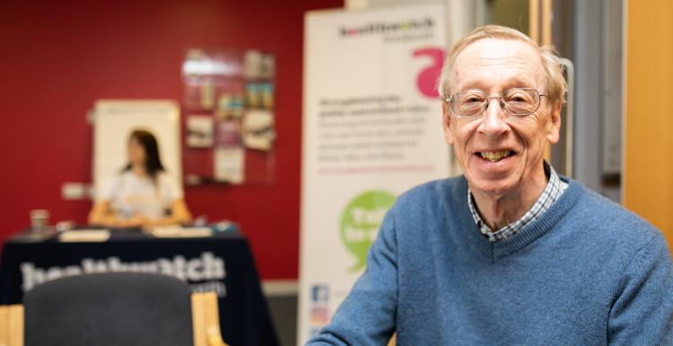 Man at a Healthwatch meeting looking at the camera