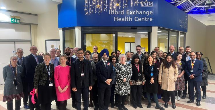 A photo of a group of people stood in front of the new Ilford Exchange Health Centre