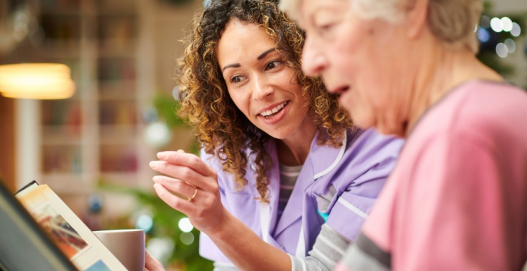 A Dementia Befrender having a cup of tea and a chat with a lady with dementia